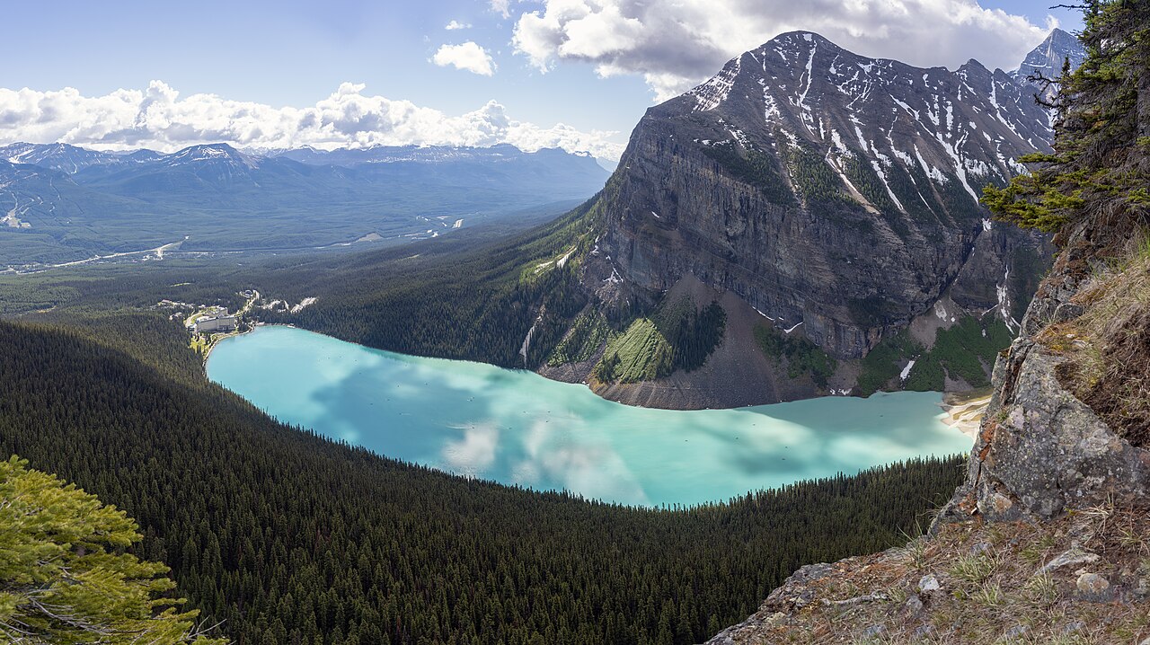 Turquoise Lake Louise surrounded by the Canadian Rockies